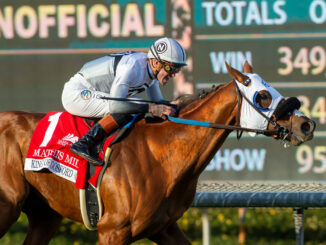 Jockey Flavien Prat exults when setting a new graded stakes record aboard King of Gosford in the Mathis Mile